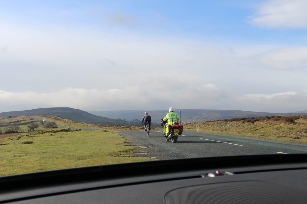 Filming the cycling videos with police motorcyclist